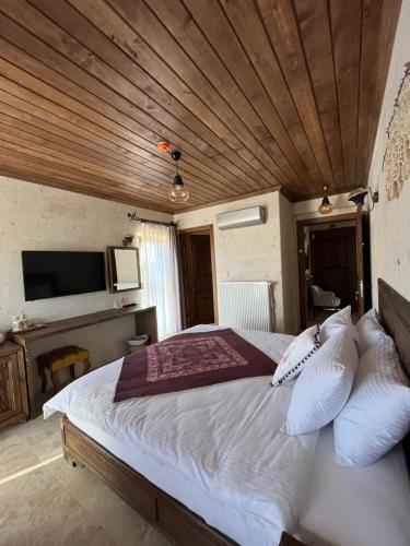 Postel nebo postele na pokoji v ubytování UCHI Cappadocia