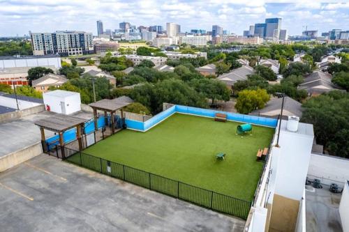 an apartment with a large yard with a green lawn at Home felt apartment- Med Center/NRG in Houston