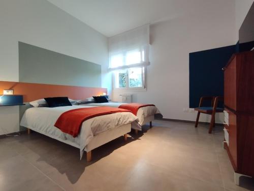 Posteľ alebo postele v izbe v ubytovaní A casa di Twiggy