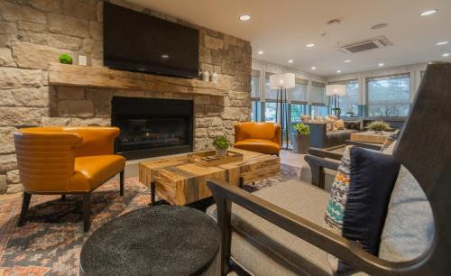 a living room with a couch and a fireplace at Multi Resorts at Lift Lodge in Park City