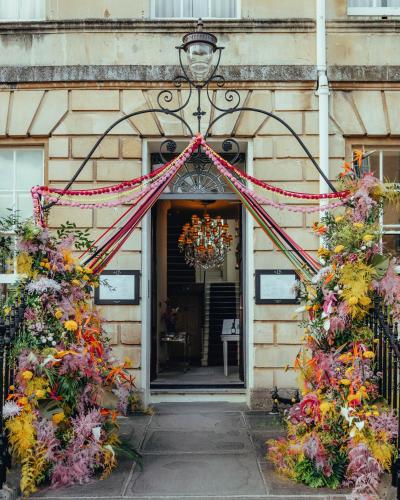 an entrance to a building with a floral wreath at No 15 by GuestHouse, Bath in Bath