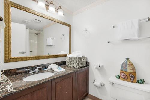 a bathroom with a sink and a mirror at Bayside Inn 6682 in Destin