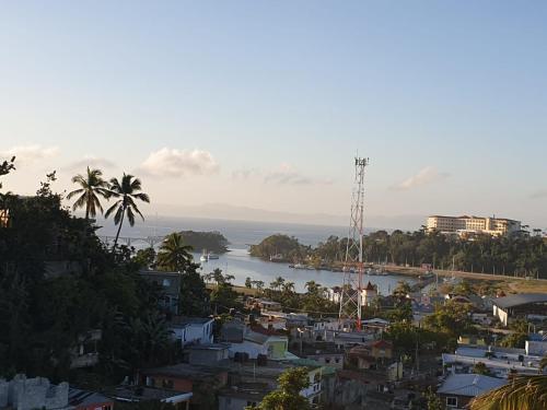 a view of a city and a body of water at Samana house in Santa Bárbara de Samaná