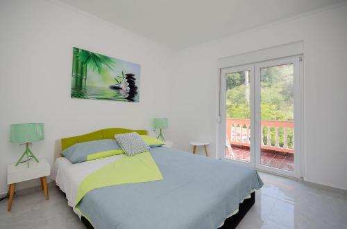 Ένα ή περισσότερα κρεβάτια σε δωμάτιο στο Apartments Darko