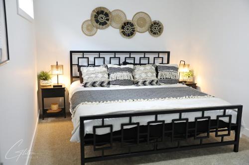 a bedroom with a large bed with pillows at King Bed,Disney,Long Stays,Garage,Airport in Edmonton