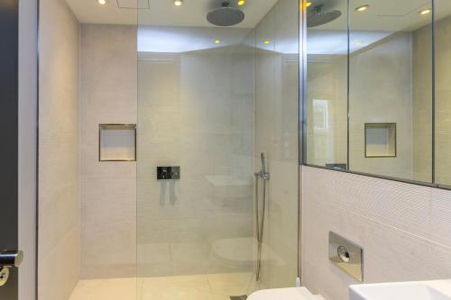 a glass shower in a bathroom with a toilet at New Build-Air Con-2 Bedroom-Two Bathrooms Apt 2 in London