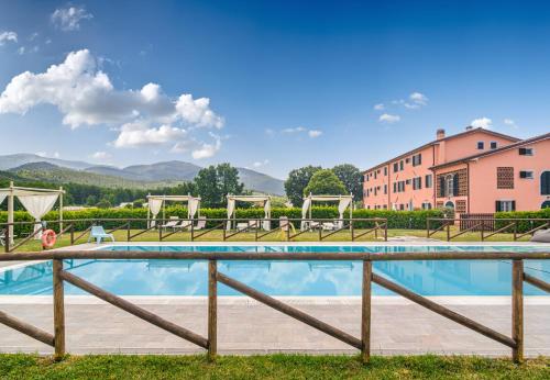 a swimming pool with a fence around it at Tenuta San Giovanni Lucca in Lucca