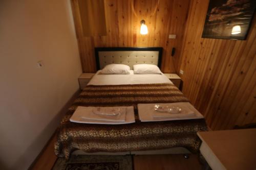 a small bedroom with a bed with two dishes on it at Private Room in Istanbul #53 in Istanbul
