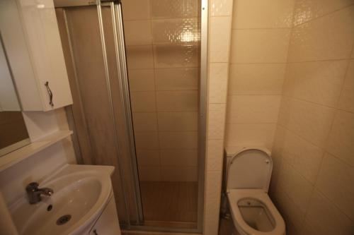 a bathroom with a shower and a toilet and a sink at Private Room in Istanbul #53 in Istanbul