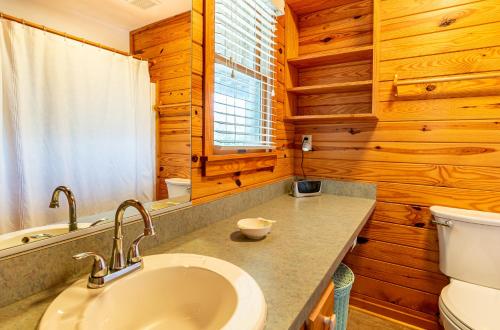 a bathroom with a sink and a toilet at Shore Enough in Sanderling