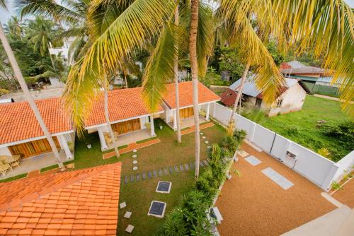 an aerial view of a house with palm trees at Tree of Life Resort in Bentota