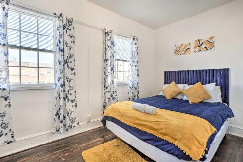 a bedroom with a bed and two windows at Baltimore Vacation Rental Near Dtwn Towson! in Baltimore