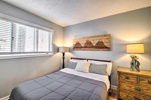 a bedroom with a bed and a dresser and a window at Wintergreen Resort Retreat - Walk to Slopes! in Lyndhurst