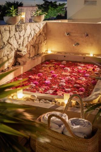a pizza with pink flowers in a stone oven at Le Muuch Hotel Boutique in Valladolid