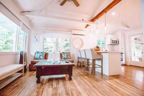 a living room with a couch and a table at ____Cute Plantation House in Kailua with AC!!_____ in Kailua