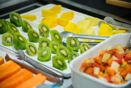a tray of fruit and vegetables on a table at Monreale Lifestyle Higienópolis São Paulo in Sao Paulo