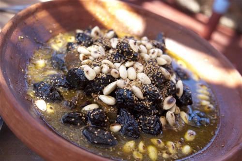 a bowl of food with nuts on top of it at Dar KamalChaoui in Bhalil