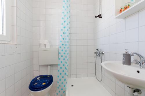 a bathroom with a shower with a toilet and a sink at Apartment Marica Sanja in Palit