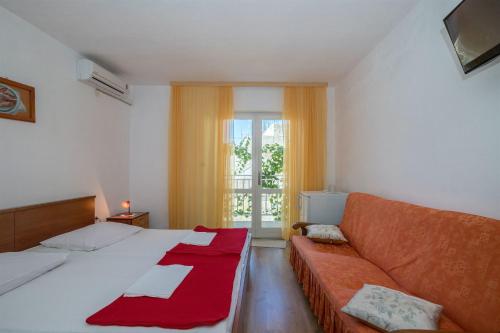 Postel nebo postele na pokoji v ubytování Apartment Ante Tonci