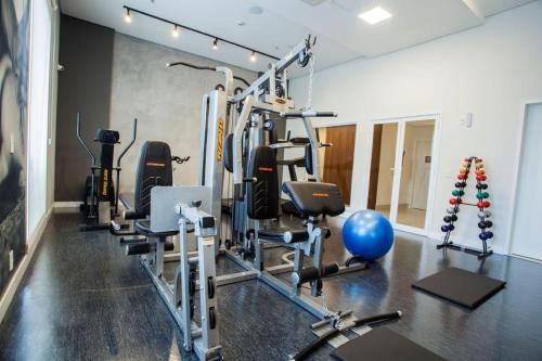 a gym with several exercise equipment in a room at Travel Inn Hotels Wise Indaiatuba in Indaiatuba