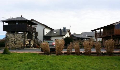 a house with a car parked in the driveway at Casa La Fonte in Barcia