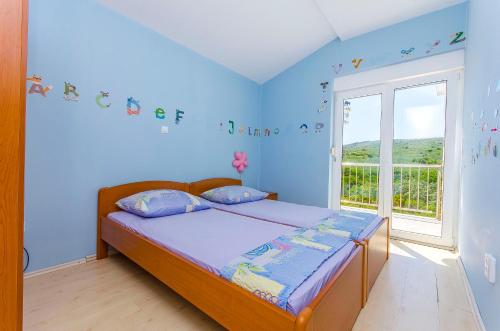 Posteľ alebo postele v izbe v ubytovaní Apartments Kazimir
