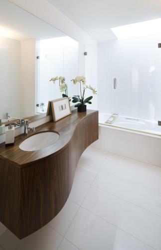 a bathroom with a sink and a mirror at Seven Books House in Carrazeda de Anciães