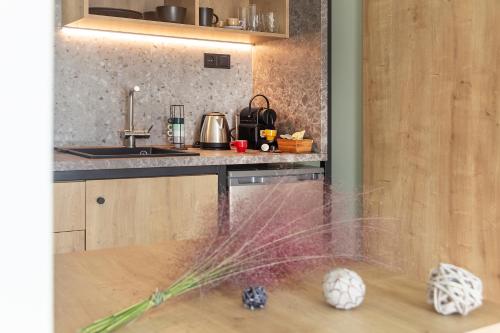 a kitchen with a counter top with a ball on the floor at Araliki Suites in Polykhrono