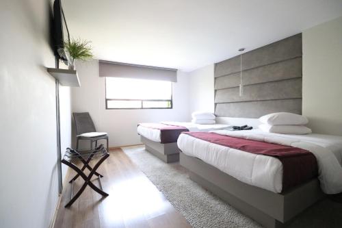 Кровать или кровати в номере Hotel Posada Tulancingo