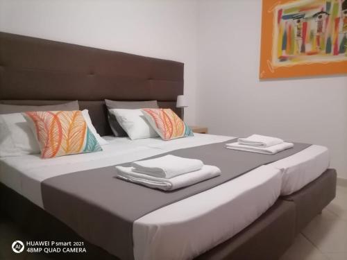 Ένα ή περισσότερα κρεβάτια σε δωμάτιο στο Solaren Apartments Boavista