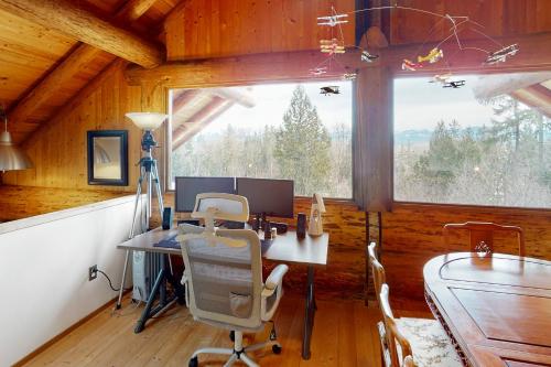an office with a desk and a large window at The Lodge in the Valley of the Moon in Carnation