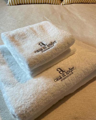 two towels sitting on top of a table at Casa De Santo Andre in Monção