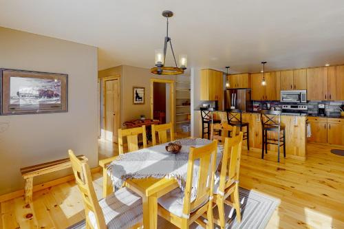 a kitchen and dining room with a table and chairs at Meadowlark Hideaway in New Meadows