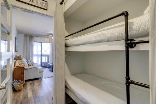 a room with two bunk beds and a couch at Spa On Port Royal Sound 2217 in Hilton Head Island