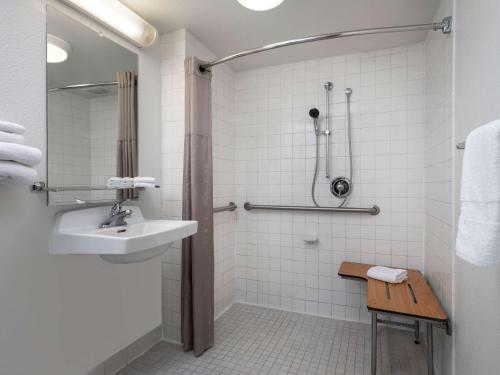 a bathroom with a sink and a shower at Motel 6-Oceanside, CA in Oceanside