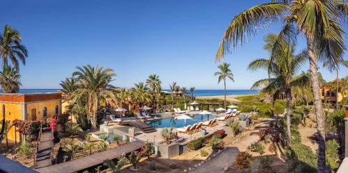 an aerial view of a resort with a pool and palm trees at Villa Santa Cruz in Todos Santos