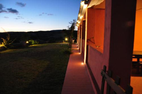 a hallway of a house with lights on the side at Stazzo La Foci soluzioni vista Mare in Aglientu