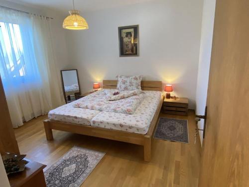 a bedroom with a bed and two lamps in it at Cozy holiday home in Paldau in a charming area in Paldau