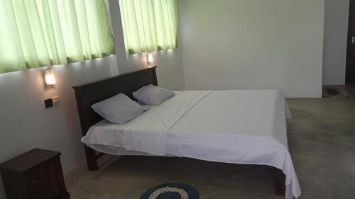 Katil atau katil-katil dalam bilik di Peaceful motel
