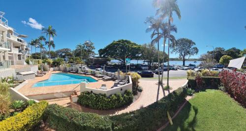 an aerial view of a house with a swimming pool at Regatta Noosa in Noosaville