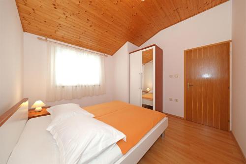 Postel nebo postele na pokoji v ubytování Apartments Boris