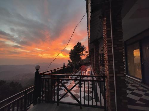 a sunset from the balcony of a house at The Lanswood Estate in Lansdowne