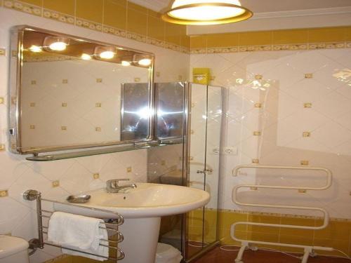 a bathroom with a sink and a shower with a mirror at Apartment - 1 Bedroom with Sea views - 00009 in Bueu