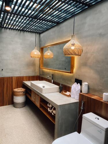 Voodi või voodid majutusasutuse Uluwatu Cottages toas