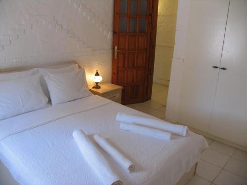 A bed or beds in a room at Pasha Apart Hotel