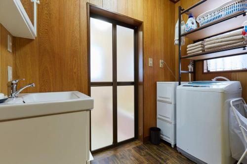 a kitchen with a sink and a washing machine at EK House Kamakura 鎌倉 Free Parking in Kamakura