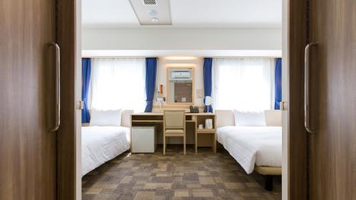Ένα ή περισσότερα κρεβάτια σε δωμάτιο στο Toyoko Inn Sodegaura eki Kita guchi