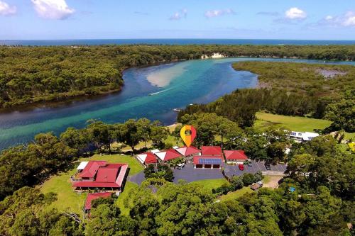an aerial view of a house next to a river at Cillanti in Sussex inlet