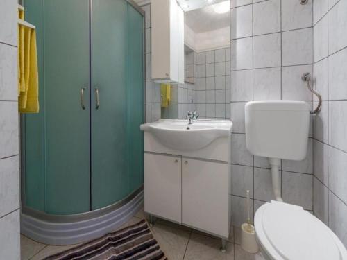 a bathroom with a toilet and a sink at Apartments Jadranka in Dramalj