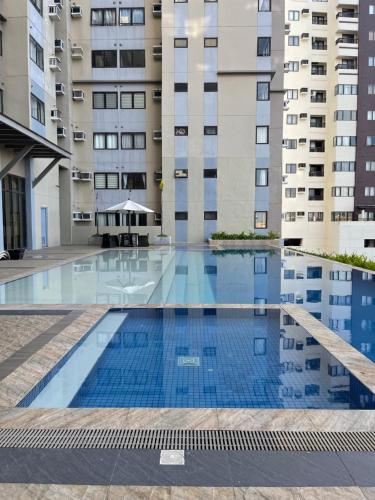 a swimming pool in the middle of a building at The Persimmon Studios Near Ayala and SM City Cebu in Cebu City